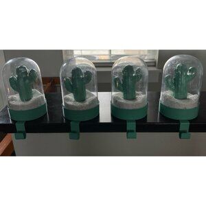 Cactus-themed snow globe stocking holder. Quantity 4.